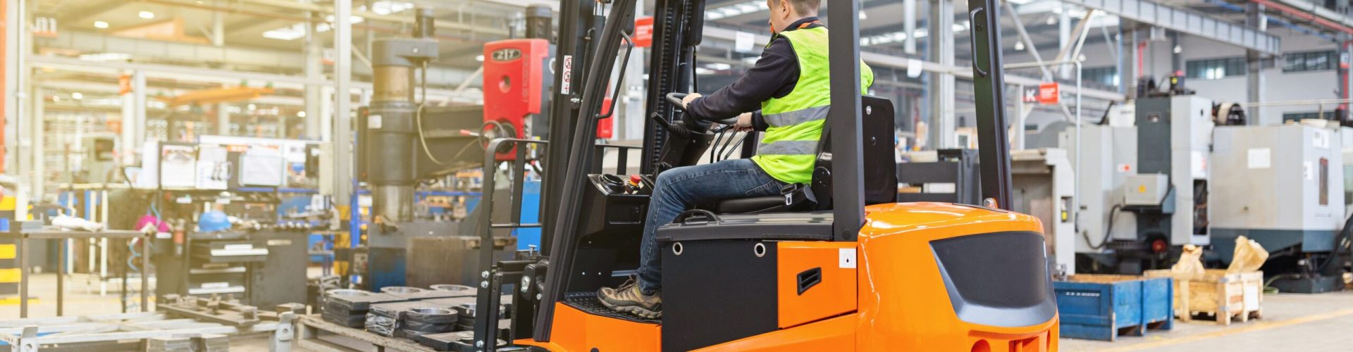 storehouse-employee-in-uniform-working-on-forklift-2023-11-27-04-52-38-utc-scaled.jpg